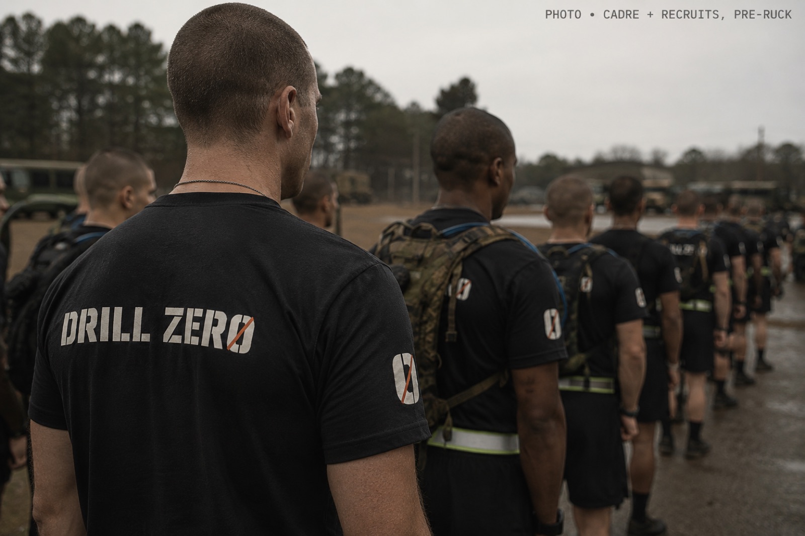 Cadre and recruits in Drill Zero shirts lined up in formation before a ruck